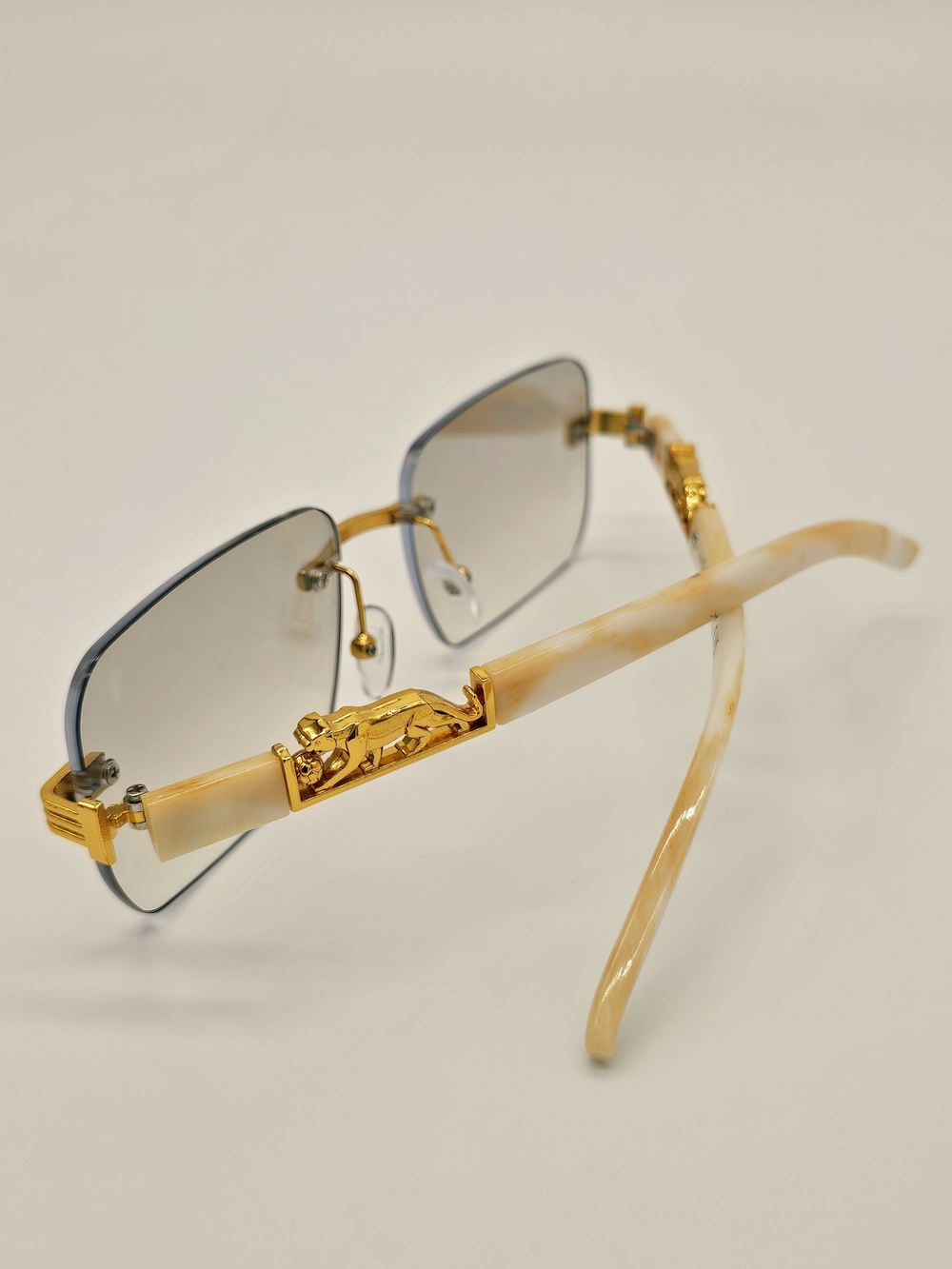 Gold-Accented Beige Rimless Sunglasses - Designer Style